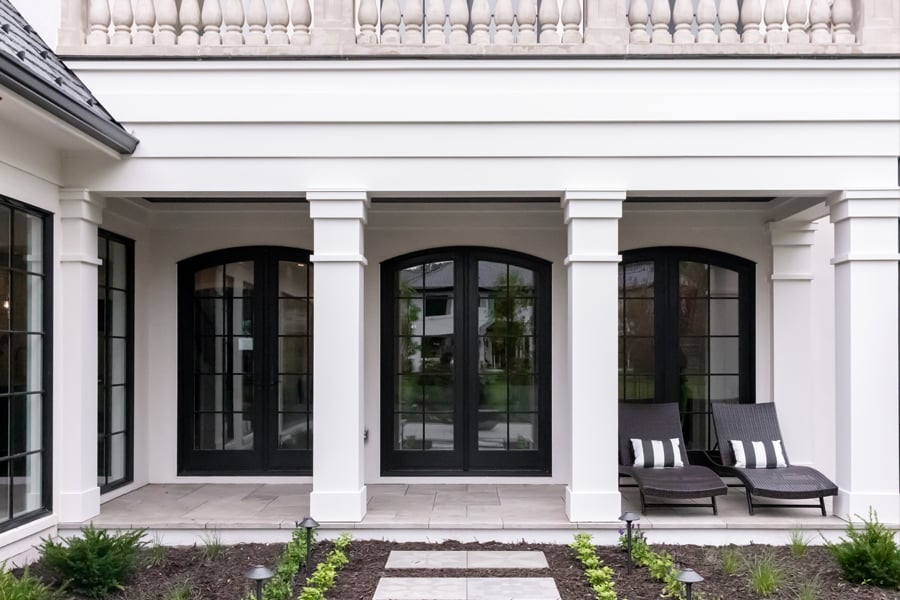 A home with three arch-topped Andersen 400 Series Hinged Patio Doors.