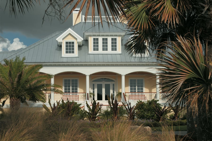 A coastal home with Andersen® 400 Series windows and patio doors with Stormwatch Protection.