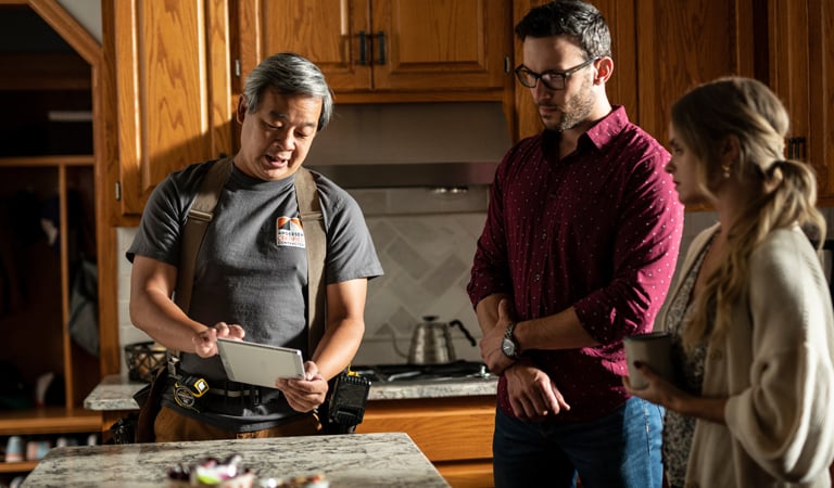 contractor showing customers samples of andersen products