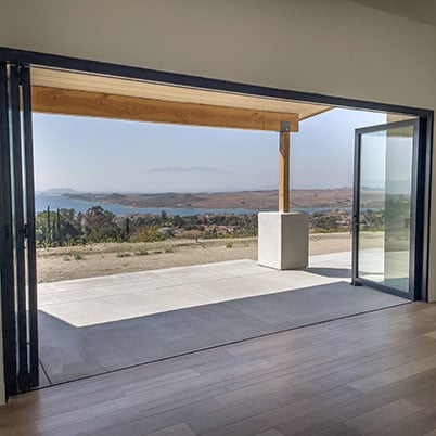 large black framed door leading to outside patio