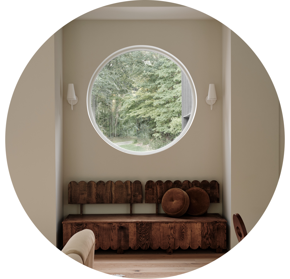 Circle window in a cozy nook with a unique bench seat