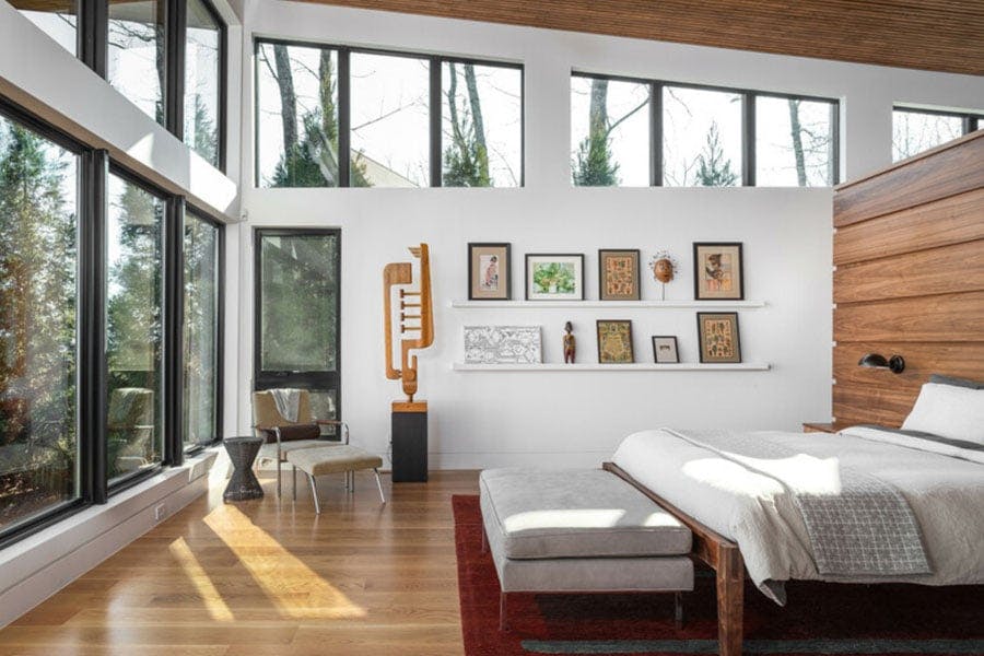 white modern living room with Dwell award title in orange bars