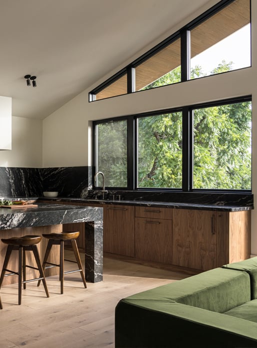 Kitchen with large awning and specialty shaped windows
