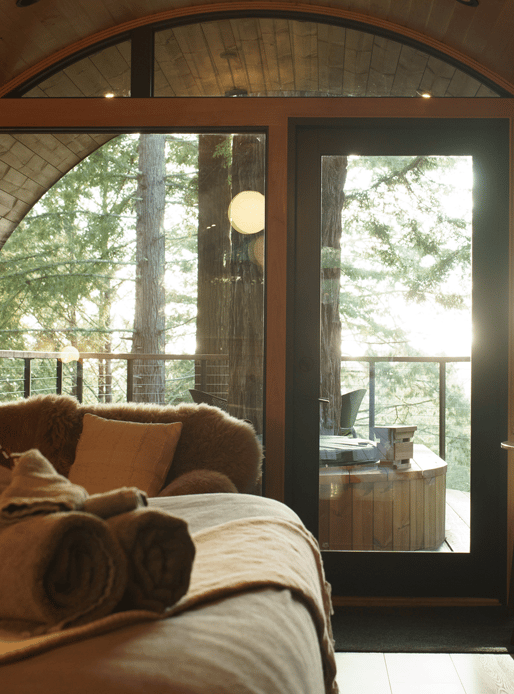 unique living room with amazing curved/arched specialty windows framing in the view of outdoors